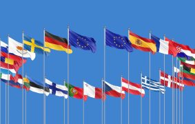 27 waving flags of countries of European Union (EU). Blue sky background. 3D illustration