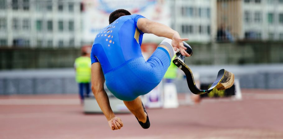 male paraathlete long jump in competition